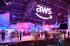 People walk around the expo hall at AWS re:Invent 2023.