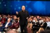 Salesforce CEO Marc Benioff speaks at Dreamforce 2025 in front of an audience wearing a black suit