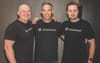  Clickhouse co-founders Yury Izrailevsky, Aaron Katz, and Alexey Milovidov pose wearing black t-shirts with the company's logo.