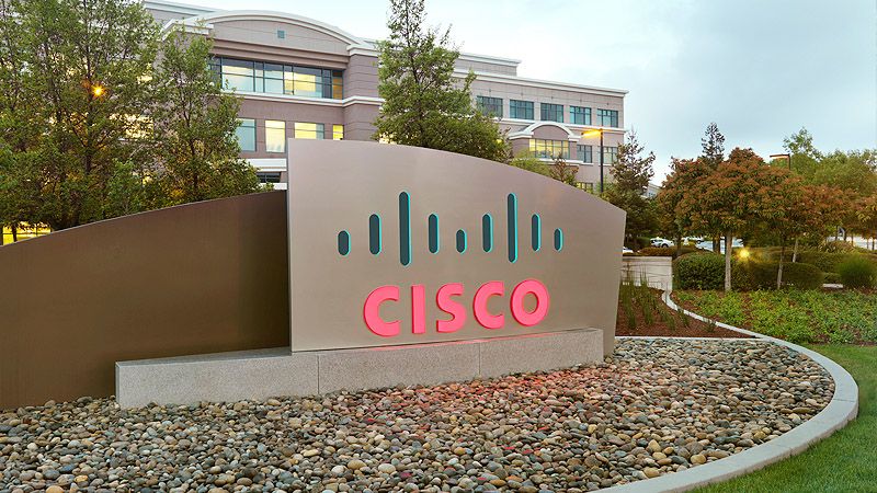 A large sign with Cisco's logo sits in front of its headquarters.