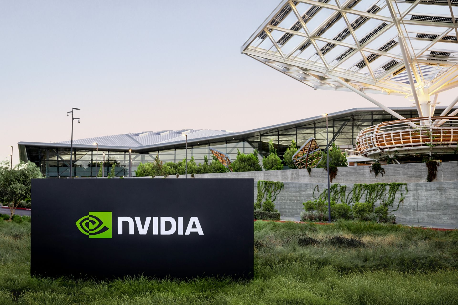 A black sign with Nvidia's logo sits in front of the Voyager building at its headquarters.